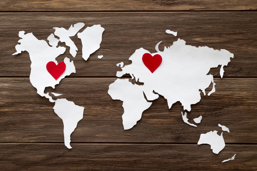 world map with hearts shutterstock 1043692450