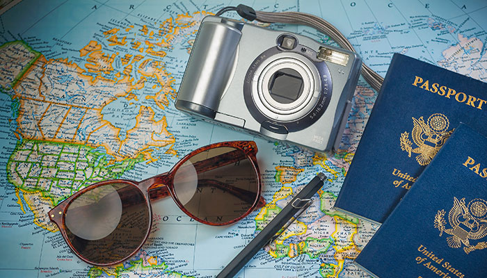 MapSunglassesPassports AdobeStock 84567014 700x400