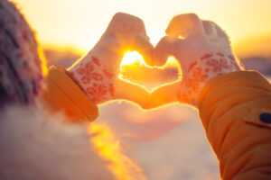 Woman,Hands,In,Winter,Gloves,Heart,Symbol,Shaped,Lifestyle,And